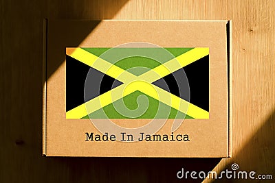 Made in Jamaica. Cardboard boxes with text `Made In Jamaica` and the Flag of Jamaica. Stock Photo