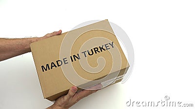 MADE IN TURKEY text on the box in hands Stock Photo