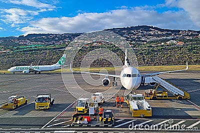 Madeira, Portugal, November 25, 2022: Aircraft service at the airport. Airplane gate. Editorial Stock Photo