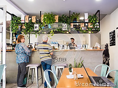 People at the Legs Eleven coffee shop in Funchal, the capital of Madeira, Portugal Editorial Stock Photo