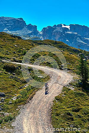 Madonna di Campiglio Tn, Italy, Cyclist climbing in the mountains Stock Photo