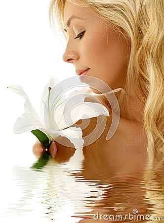 Madonna lily girl in water Stock Photo