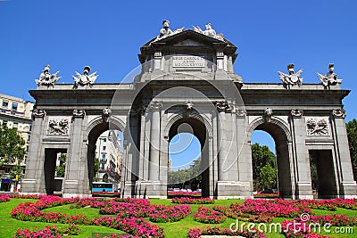 Madrid Puerta de Alcala with flower gardens Stock Photo