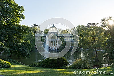 Madrid / Spain - 02 August 2019: Crystal Palace in the Famous Retiro park in Madrid, in the sunset. Spanish public art museum with Editorial Stock Photo