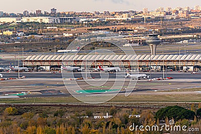 Control tower, terminal and some airplanes at Adolfo Suarez Madrid Barajas airport Editorial Stock Photo