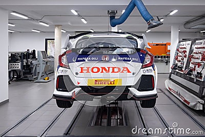 MADRID, SPAIN - December, 2019: Honda race car is being prepared for competition. Fast sports vehicle is checked by mechanics at Editorial Stock Photo