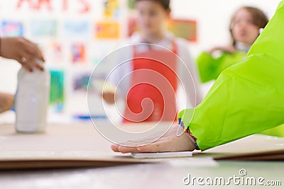 Madrid, Spain, february 7, 2020: Close-up of a children in art therapy class drawing, painting and practicing engraving art. Child Stock Photo