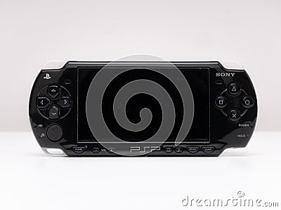 Front view of the famous Sony PSP Playstation Portable video game console in black on a white background Editorial Stock Photo