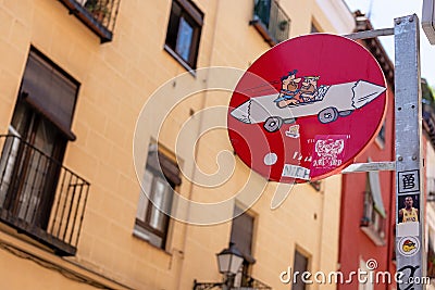 Madrid, Spain 22 July 2018 - modern street art, road sign with drawing Editorial Stock Photo