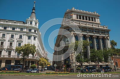 Buildings on the busy street with people and cars in Madrid Editorial Stock Photo