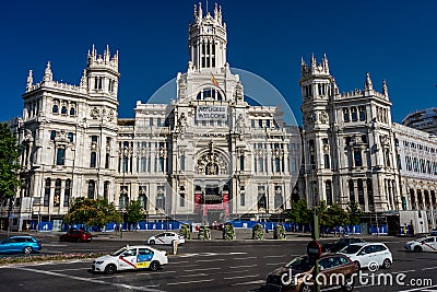 Madrid, Spain - June 17 : The Madrid city hall on June 17, 2017. A welcome refugees banner is displayed on the city hall. Editorial Stock Photo