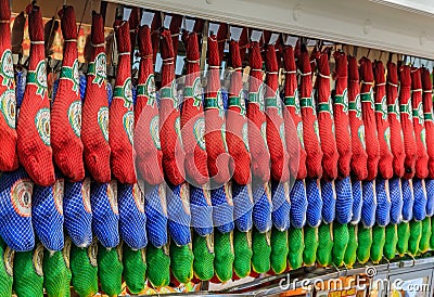 Whole legs of serrano iberico ham on display at a local market in Madrid, Spain Editorial Stock Photo