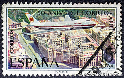 Iberia airplane flying Cibeles palace in Madrid Editorial Stock Photo