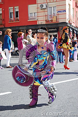 Madrid, Spain, March 2nd 2019: Carnival parade, Girl from Bolivian dance team dancing with typical costume Editorial Stock Photo