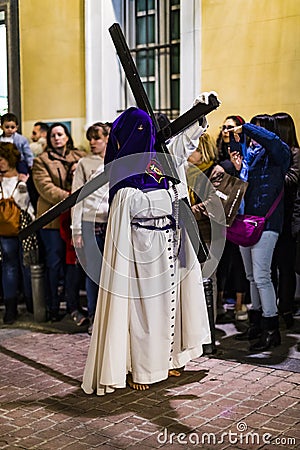 The traditional profession of religious Catholic orders during the Holy Week of the course of sinners along the streets of Madrid. Editorial Stock Photo