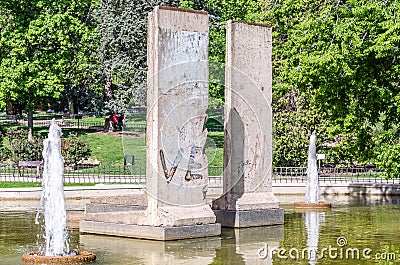 Berlin Park in Madrid, Spain. View of a fountain with original remains of the Berlin Wall Editorial Stock Photo