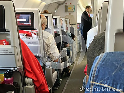 IBERIA Aircraft interior. Airplane interior - people sitting on seats Editorial Stock Photo