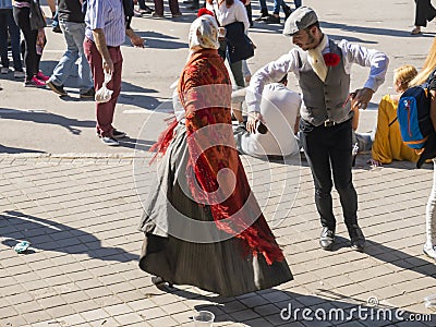 Couple dancing in traditional dresses. San Isidro Editorial Stock Photo