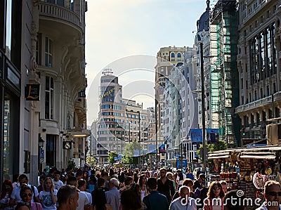 Throng or crowd of people on the Gran Via in the Spanish Capital city. Rush hour in Madrid, Spain Editorial Stock Photo