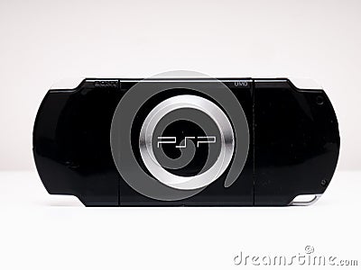 Rear view of the famous Sony PSP Playstation Portable video game console in black on a white background Editorial Stock Photo