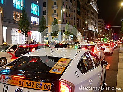 Car taxi traffic in downtown madrid gran via at night Editorial Stock Photo