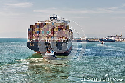 Maersk Kowloon cargo container ship entering port of Livorno, Italy Editorial Stock Photo