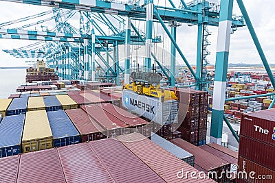 Maersk owned container loaded by the gantry crane on the container ship. Editorial Stock Photo