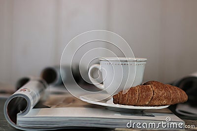 Magazines coffee croissant Stock Photo