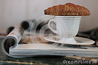 Magazines coffee croissant Stock Photo