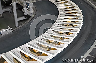 Magazines on conveyor belt in print plant Stock Photo