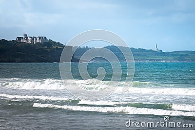 Magdalena Palace and Cabo Mayor lighthouse from El Puntal beach, Spain Stock Photo