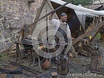 Magdeburg, Germany - 29.08.2014: Kaiser-Otto-Fest. Reconstruction of historical events of the city. Blacksmith from the middle Editorial Stock Photo