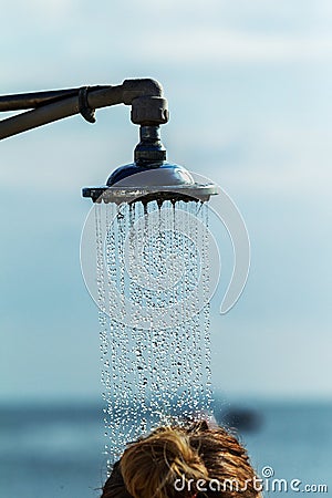 Mage of a vintage old shower head splashing water close up background. Water flows from the head of an old shower. Background for Stock Photo