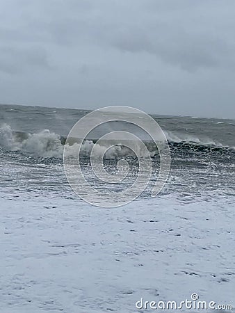Waves hitting Selsey beach Stock Photo