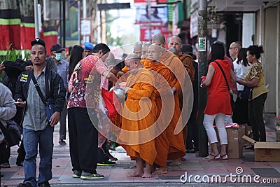 Pindapata - Monks Collecting the food from Buddhist peoples Vesak Day Editorial Stock Photo