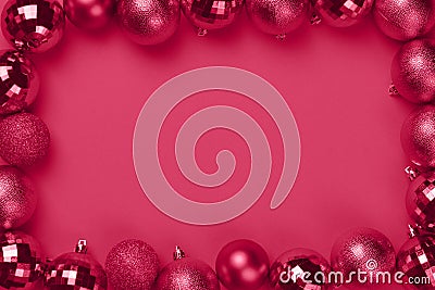 Magenta Christmas decorations on pink background with copy space Stock Photo