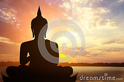 Magha Asanha Visakha Puja Day , Silhouette Buddha on golden sunset background Stock Photo