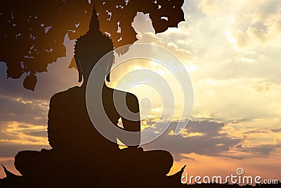 Magha Asanha Visakha Puja Day , Silhouette Buddha on golden sunset background Stock Photo