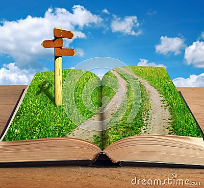 Magic book with road inside and signpost Stock Photo