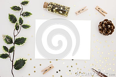 Magic Christmas. Blank card invitation banner mockup, festive stationery and decorations, golden stars, green branch Stock Photo