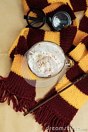 Magic composition with a cup of cocoa, a magic wand, a scarf on Stock Photo