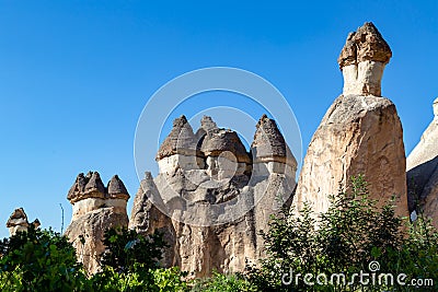 Magic fungous forms of sandstone in the canyon near Cavusin village, Cappadocia Stock Photo