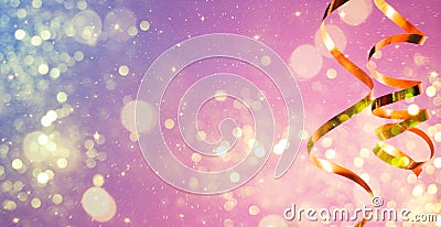 Magic and glowing party background with a golden streamer and pastel colors Stock Photo