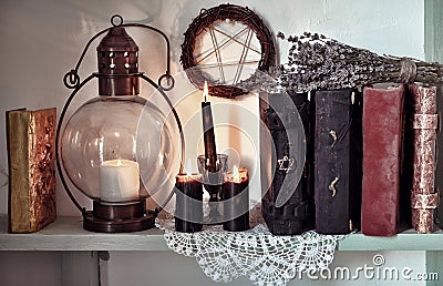 Burning black candles, old-fashioned lamp and pentagramBurning black candles, old-fashioned lamp and pentagram Stock Photo