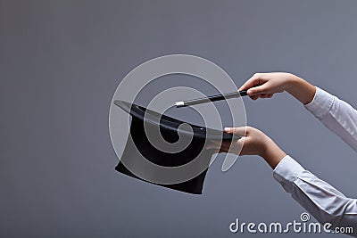 Magic hat and wand in child hands Stock Photo