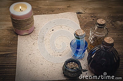 Magic potion and blank recipe scroll. Phytotherapy. Alternative herbal medicine. Shaman. Druidism. Stock Photo