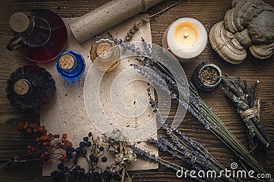 Magic potion and blank recipe scroll. Phytotherapy. Alternative herbal medicine. Shaman. Druidism. Stock Photo