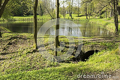 Public gardens in Chotebor with pond during spring season, romantic scene, water reflections Stock Photo