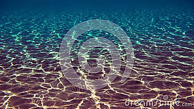 Magic underwater light over the sand bottom Stock Photo