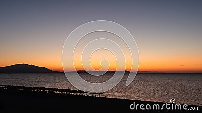 Magical Colors on the Horizon Moments Before Sun Goes Up. Sunrise in Nea Vrasna, Greece Stock Photo